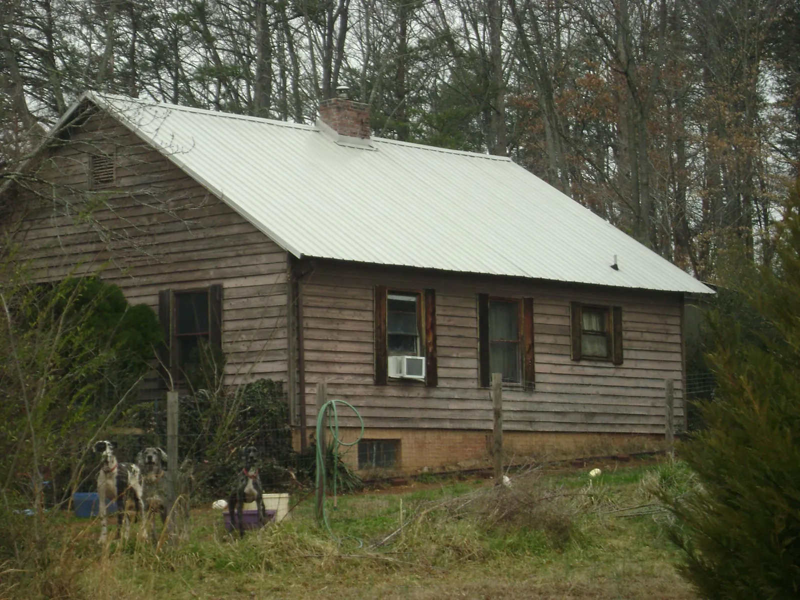 White metal roof on an old wood sided farmhouse, from a Metal Roof Installation job in Blairstown